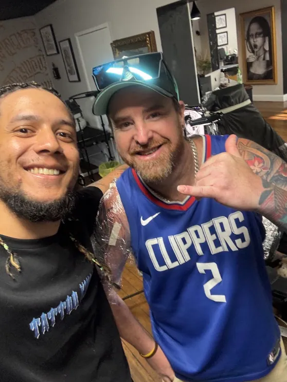 Julio Falcon with a client after a session